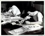 Two Students Working Over Newspaper Paper, Student Candids ca. 1950s - 60s by Paul Allard