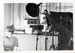 Photo Student Setting Up Lighting in the Photo Studio by Art Institute of Boston