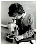 Student Looking Through the Microscope, Student Candids, ca. early 1960s