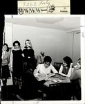 Students at a Table with Checks and Ashtray, Student Candids ca. 1966